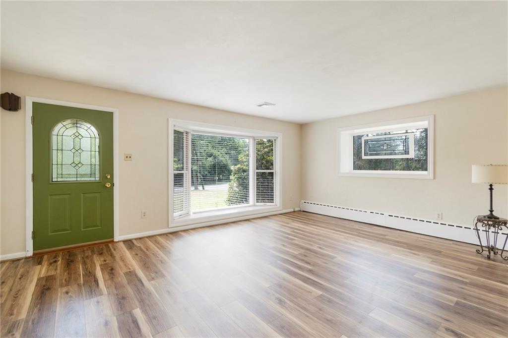 8855 Peebles Road Allison Park, PA 15101 - Photo 3 of 26 a view of an empty room with wooden floor and a window
