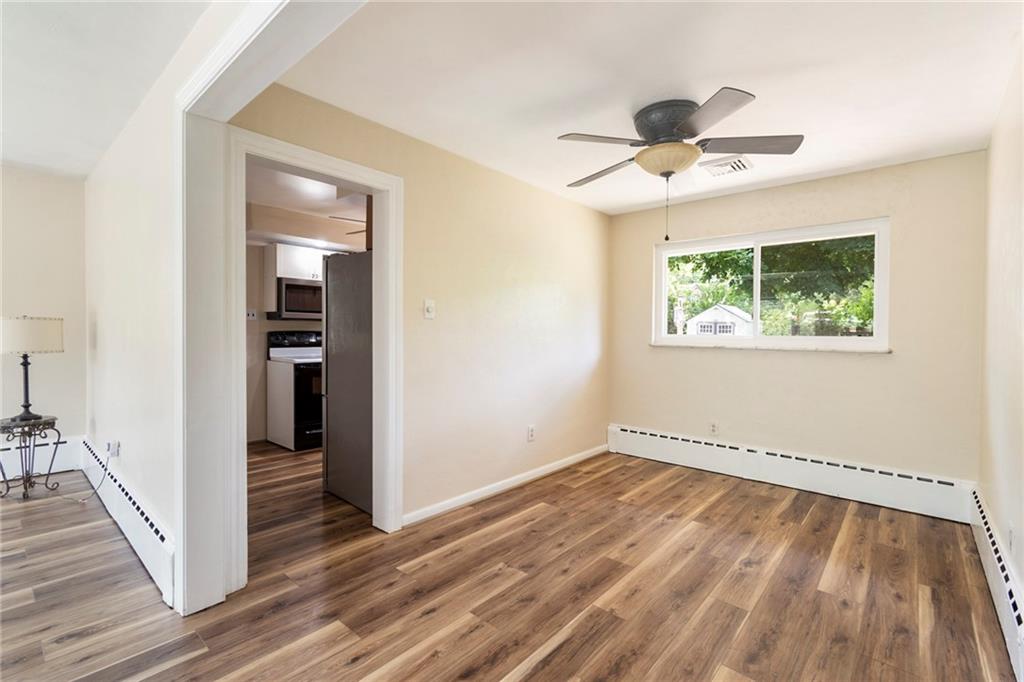 8855 Peebles Road Allison Park, PA 15101 - Photo 5 of 26 wooden floor in an empty room with a window