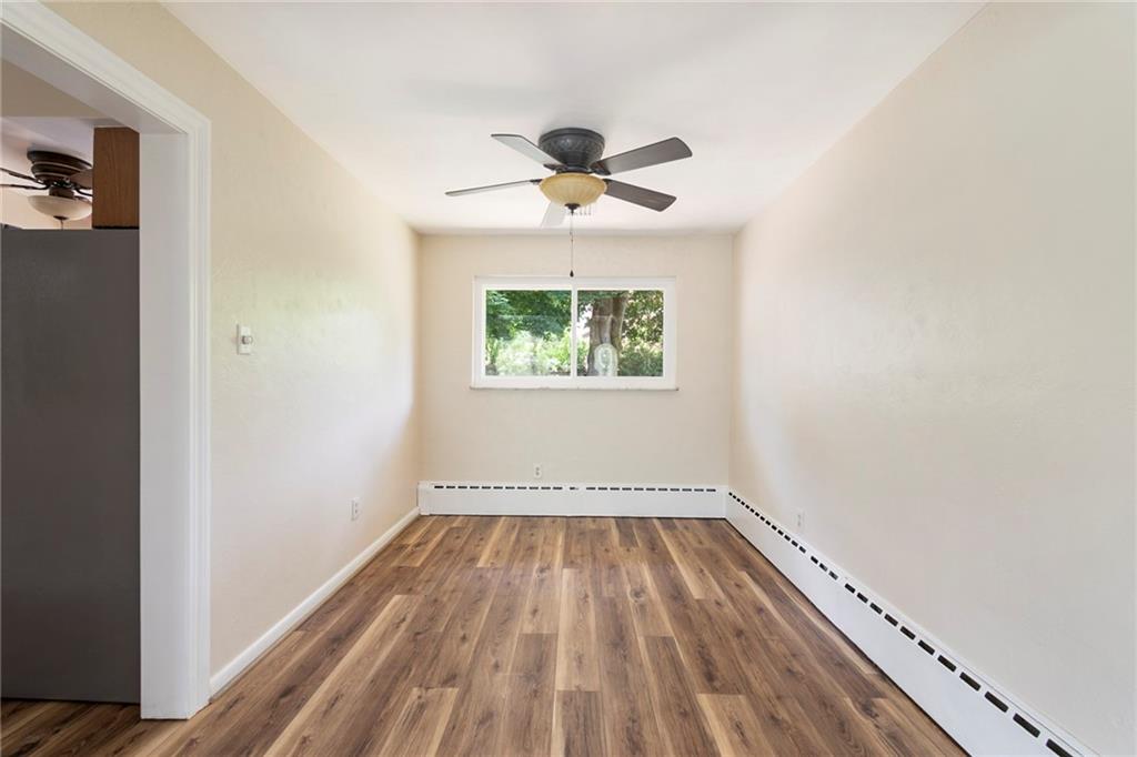 8855 Peebles Road Allison Park, PA 15101 - Photo 6 of 26 a view of room with window ceiling fan and hardwood floor
