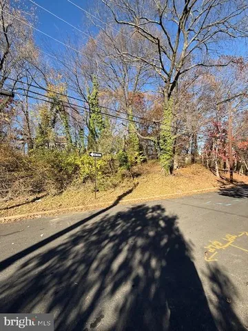 a view of yard covered with snow in front of house