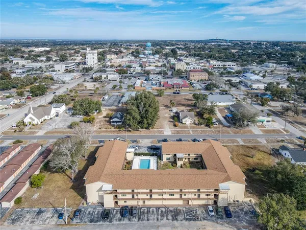 an aerial view of a house with a ocean view