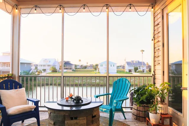 a view of a balcony with lake view and a potted plant