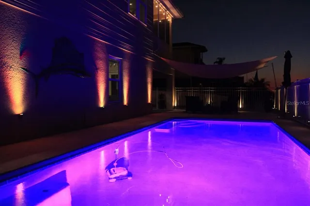 a room with furniture pool table table and chairs