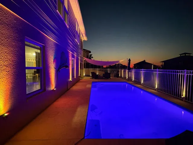 a view of swimming pool with a yard from a seating space