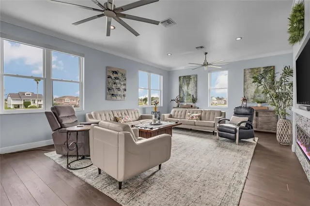 a living room with furniture and a large window