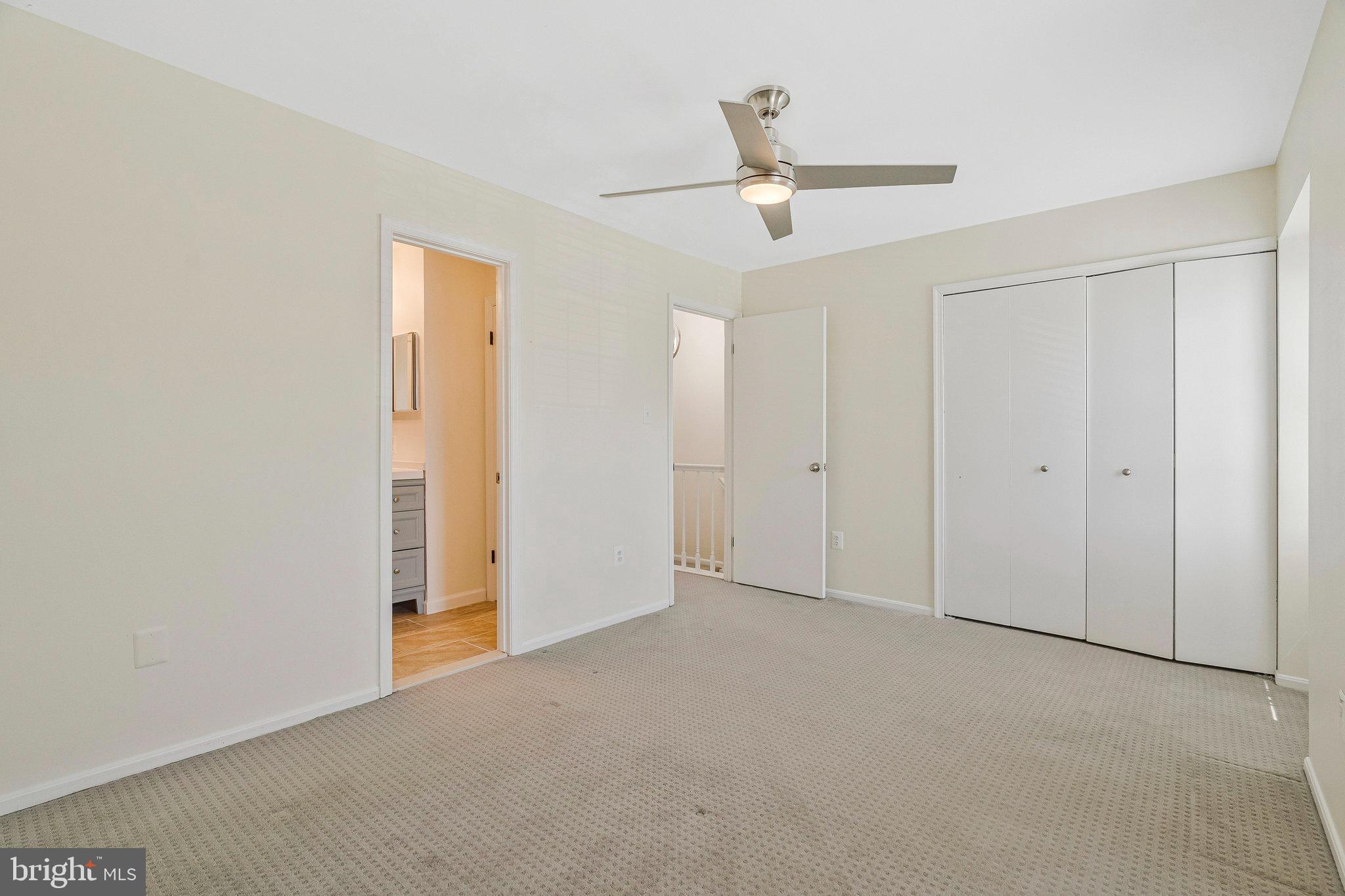 22303 Mayfield Square Sterling, VA 20164 - Photo 17 of 24 an empty room with a ceiling fan