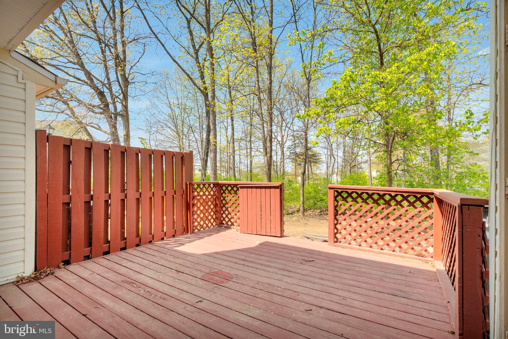 22303 Mayfield Square Sterling, VA 20164 - Photo 5 of 24 a wooden house with trees in front of it