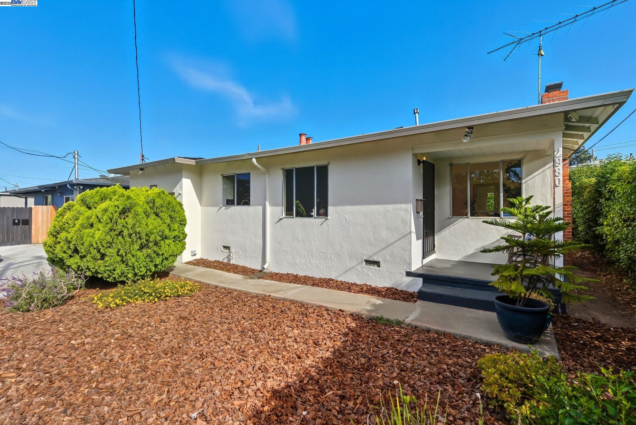 a front view of a house with garden