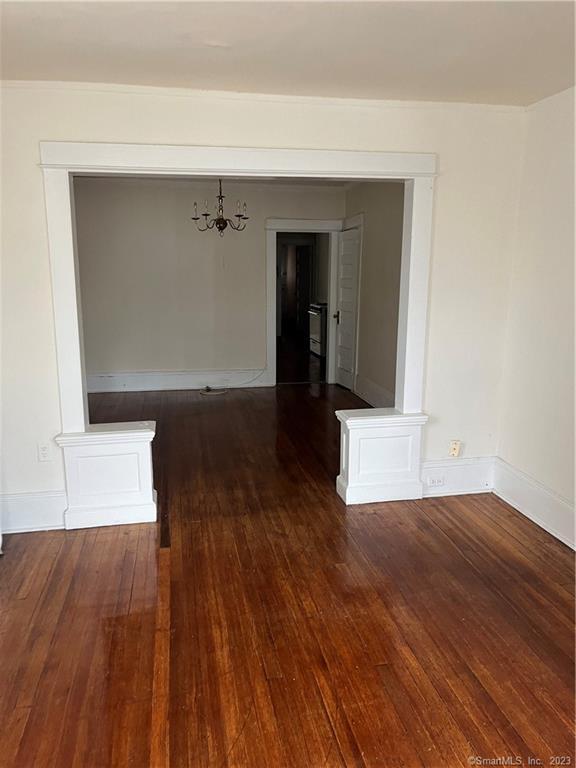 50 Carleton Avenue, Unit 3R Bridgeport, CT 06604 - Photo 4 of 4 a view of a room with wooden floors and cabinet