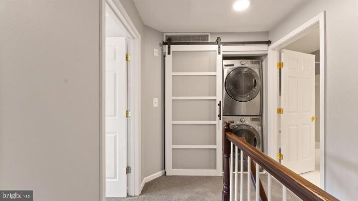 1918 Crescent Park Drive Reston, VA 20190 - Photo 24 of 33 Sleek laundry nook with sliding door.