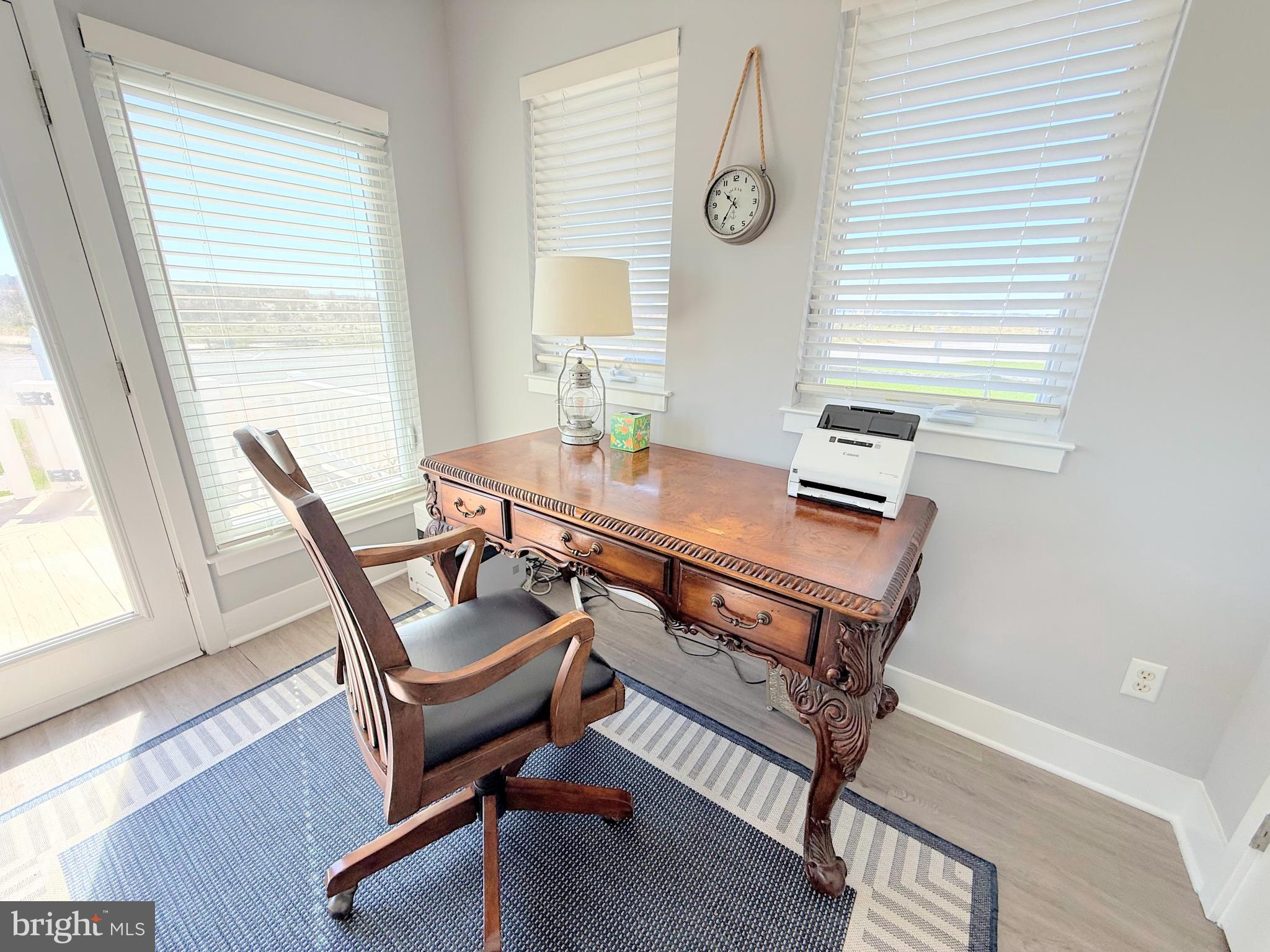 37219 Sandpiper Road, Unit 47 Long Neck, DE 19966 - Photo 23 of 62 a view of a workspace with furniture and a window