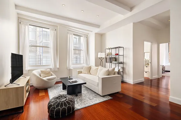 a living room with furniture and a window