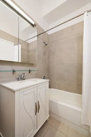 a bathroom with a sink and a bathtub