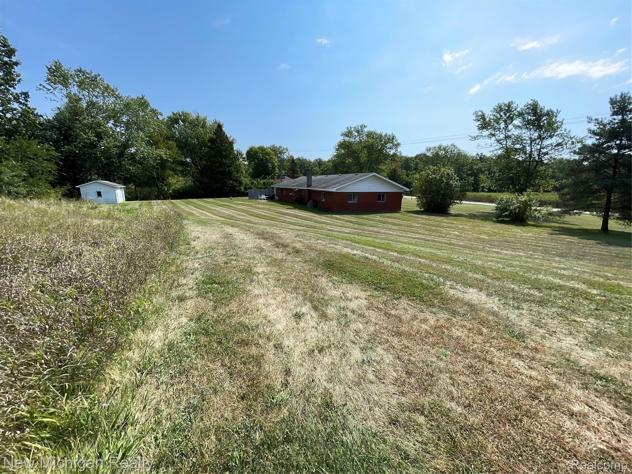 11065 Hyne Road Brighton, MI 48114 - Photo 2 of 16 02 Back Exterior.jpeg