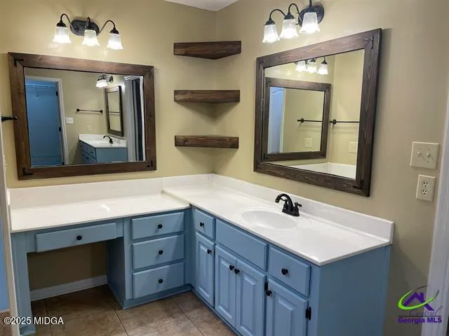 a bathroom with a double vanity sink and a mirror