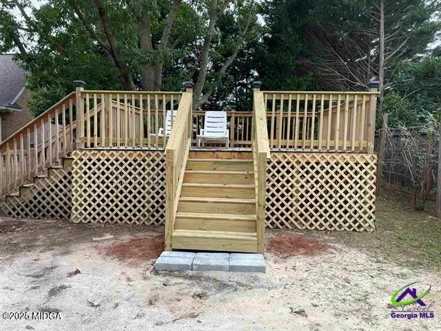 a view of outdoor space with deck fence