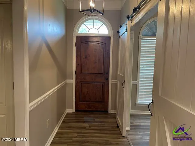 a view of entryway with wooden floor