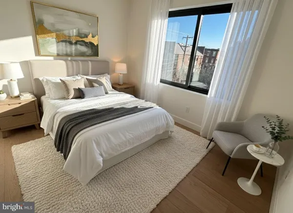 a bedroom with a bed and window