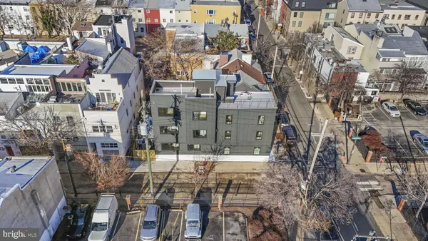 an aerial view of residential houses with outdoor space