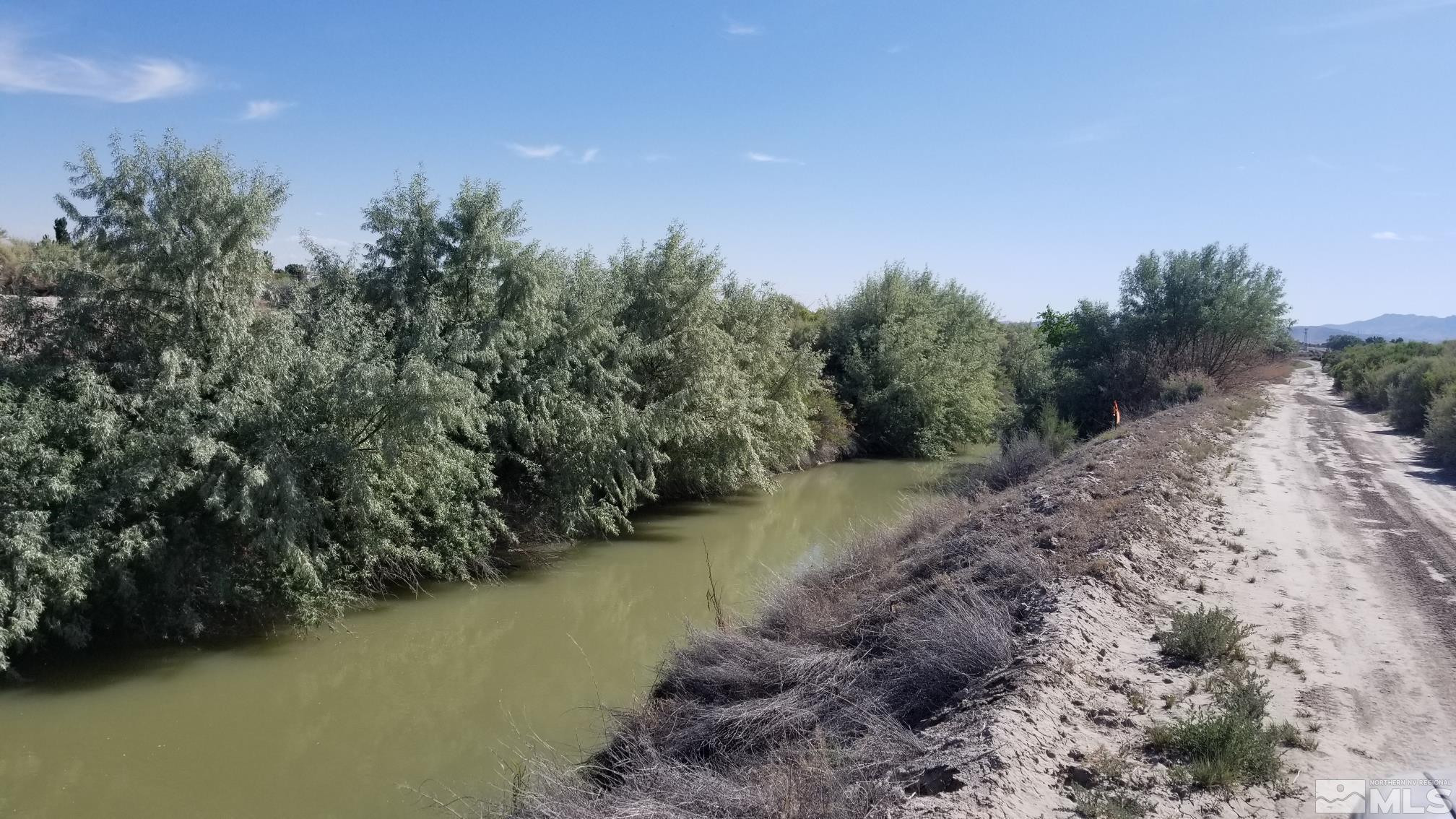 200 Raymond Road Lovelock, NV 89419 - Photo 2 of 18 a view of a lake with trees in the background