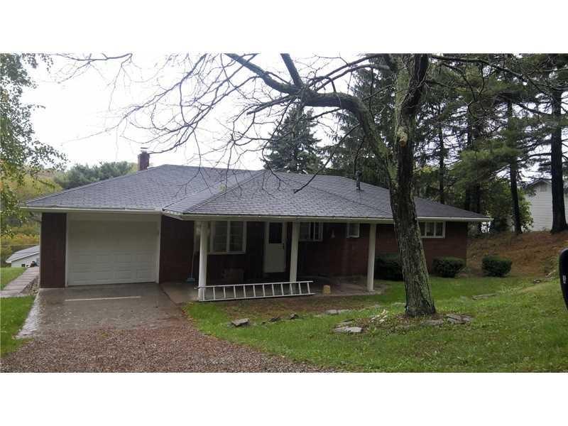 a black and white house with a yard