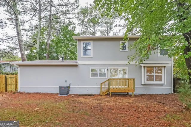 a house with trees in front of it