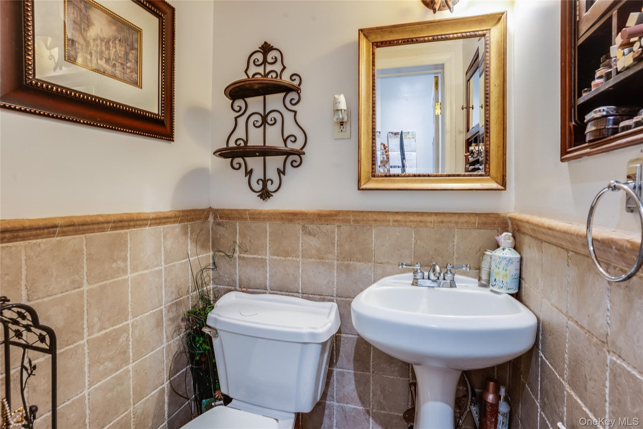 122 Hamilton Road Hempstead, NY 11550 - Photo 16 of 20 Half bath with wainscoting and tile walls