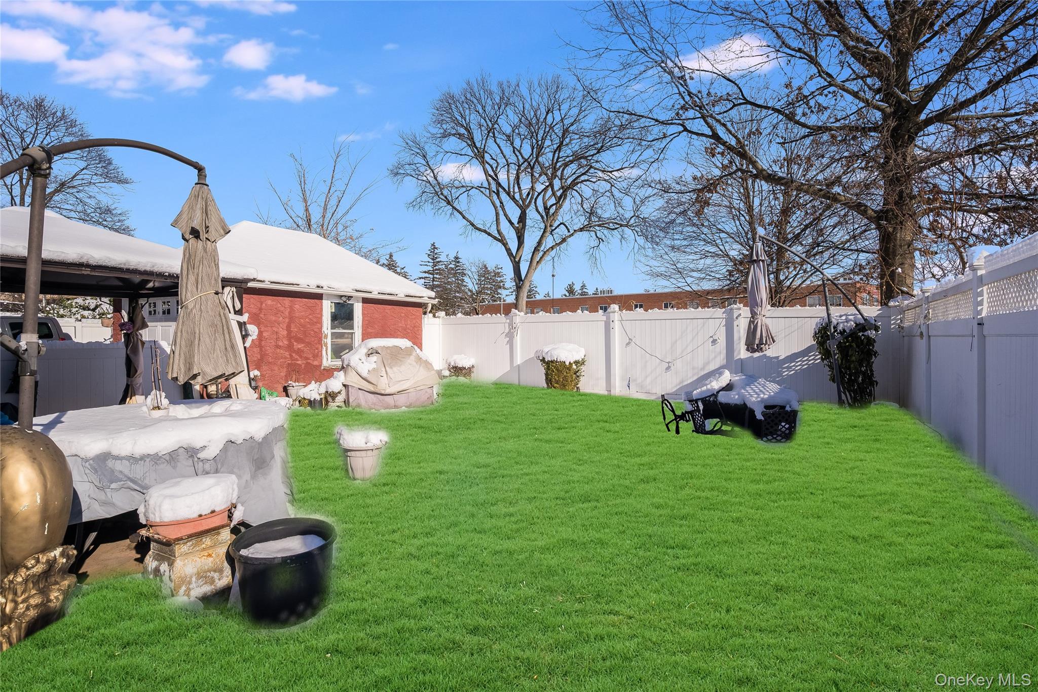 122 Hamilton Road Hempstead, NY 11550 - Photo 18 of 20 Fenced backyard featuring a gazebo