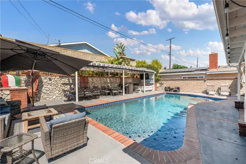 a view of a swimming pool with a patio