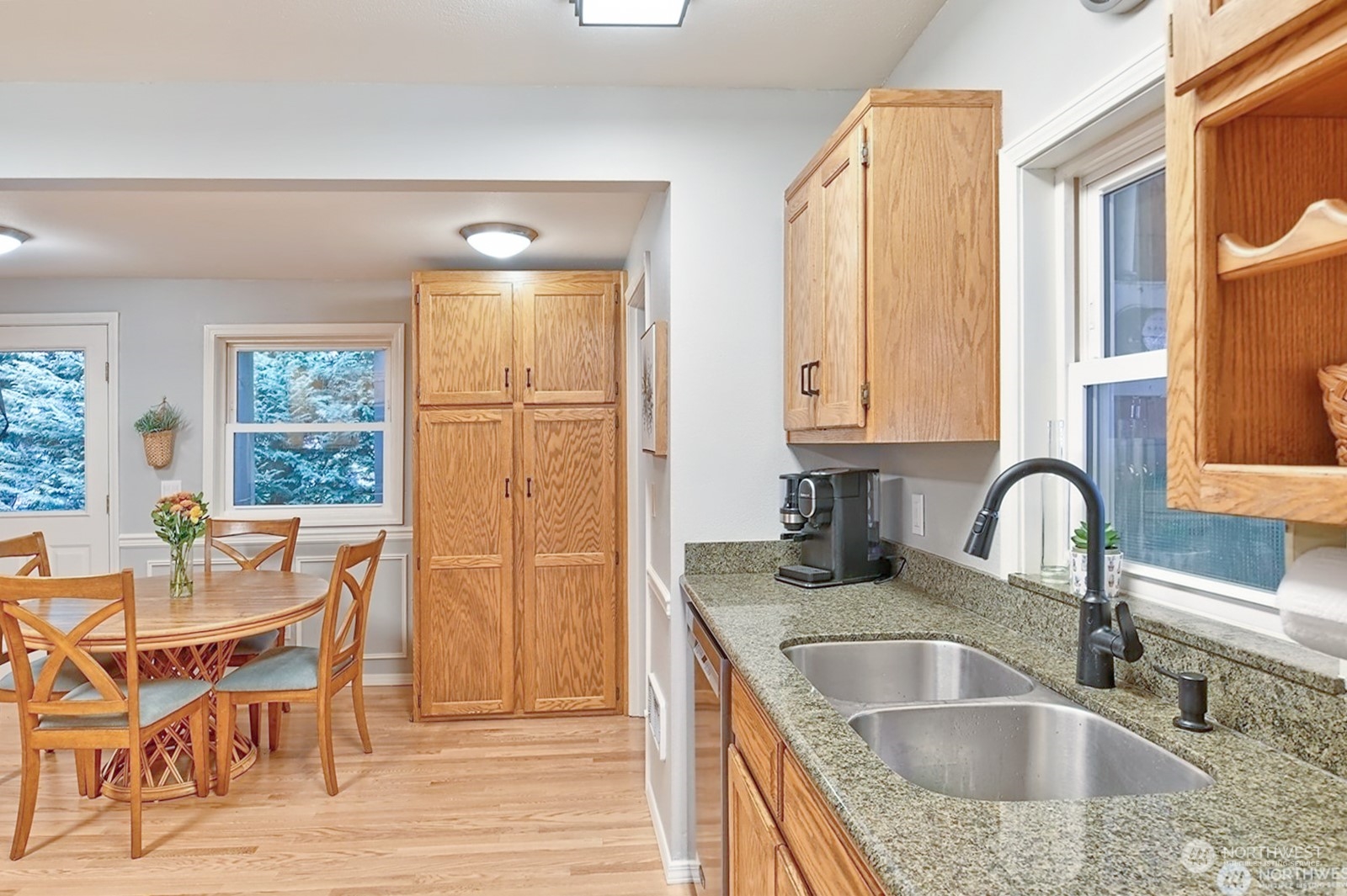 11019 Uct Loop Road Lake Stevens, WA 98258 - Photo 16 of 38 a kitchen with granite countertop a dining table chairs and granite counter tops