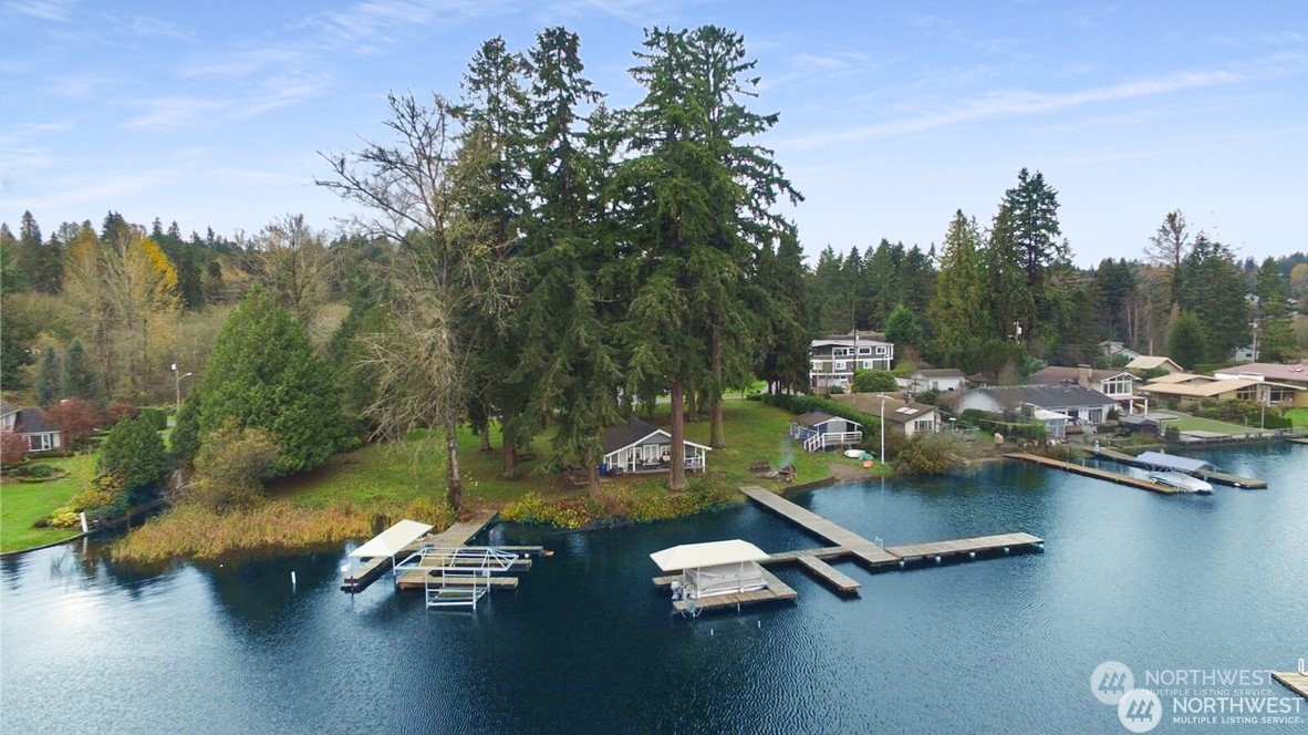 11019 Uct Loop Road Lake Stevens, WA 98258 - Photo 8 of 38 a view of a lake with lawn chairs