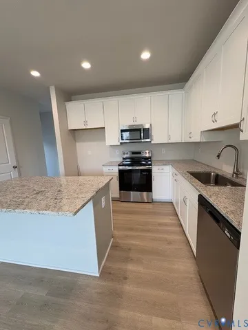 a bedroom with a bed and a lamp