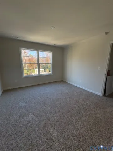 a bed room with a bed and a couch