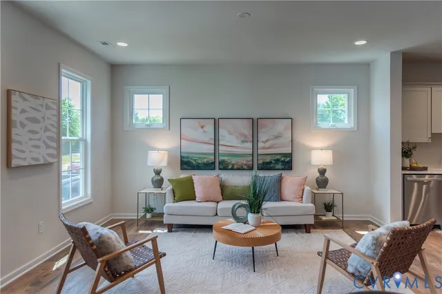 a kitchen with white cabinets sink and stainless steel appliances