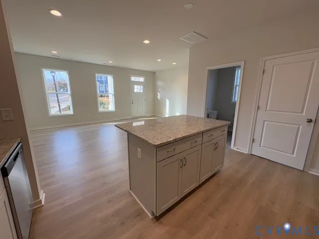 a bathroom with a shower and a window