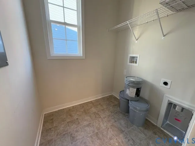 a living room with furniture kitchen view and a large window
