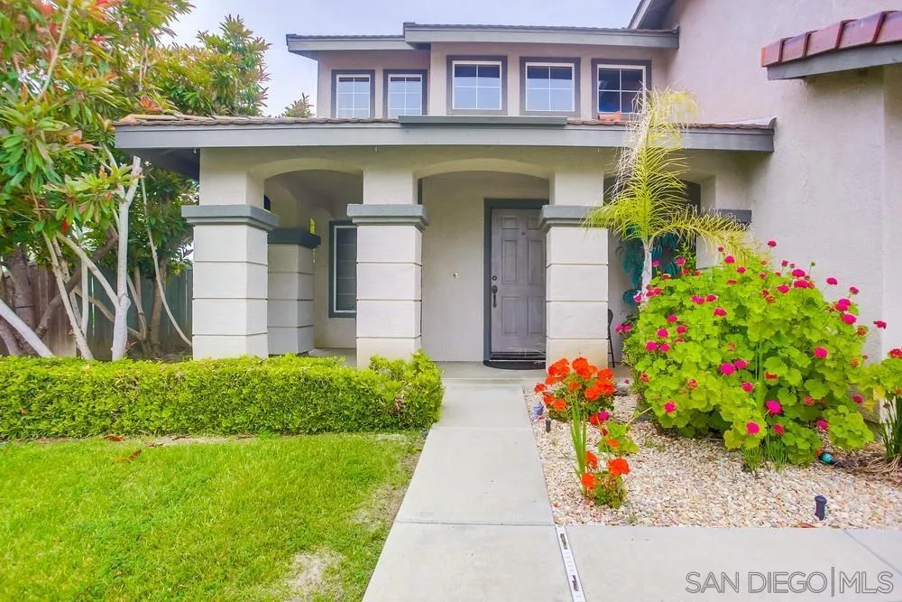 498 Shadow Tree Drive Oceanside, CA 92058 - Photo 3 of 42 a front view of a house with a yard