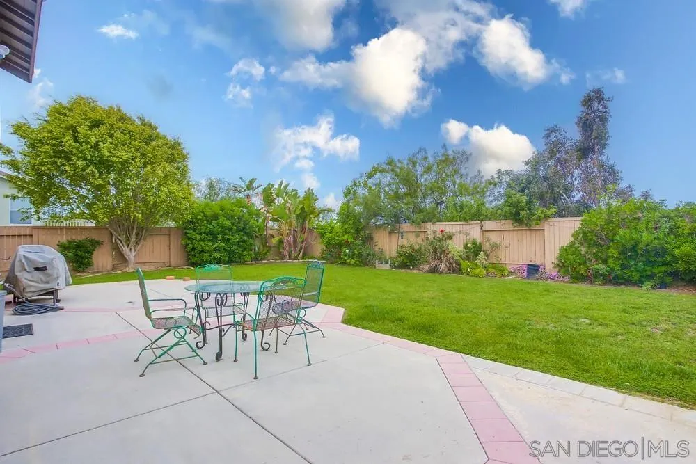 498 Shadow Tree Drive Oceanside, CA 92058 - Photo 36 of 42 a view of a chairs and table in backyard