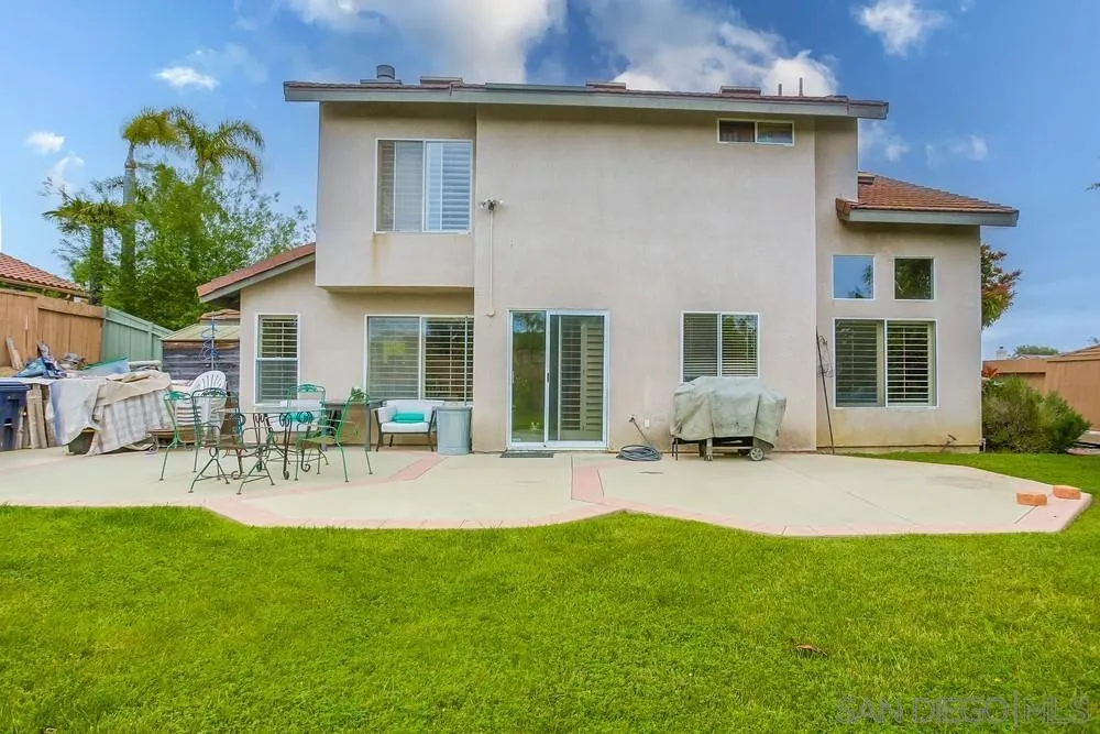 498 Shadow Tree Drive Oceanside, CA 92058 - Photo 39 of 42 a front view of a house with patio and a garden