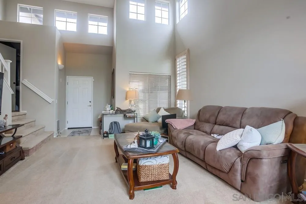 498 Shadow Tree Drive Oceanside, CA 92058 - Photo 5 of 42 a living room with furniture and a large window
