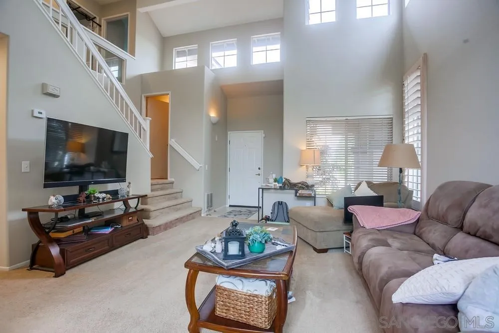 498 Shadow Tree Drive Oceanside, CA 92058 - Photo 6 of 42 a living room with furniture and a flat screen tv