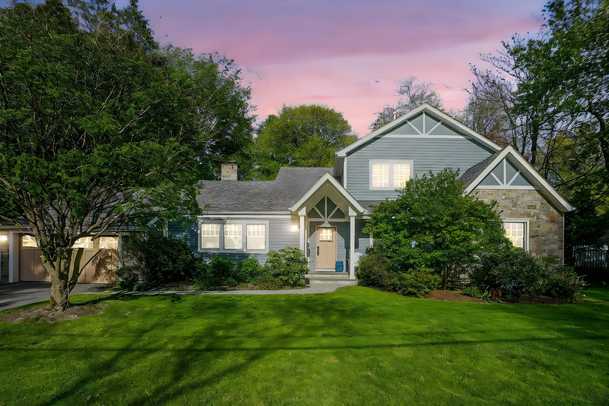 a front view of a house with a yard