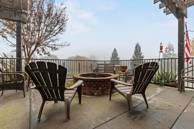 a view of a chairs and table on the deck