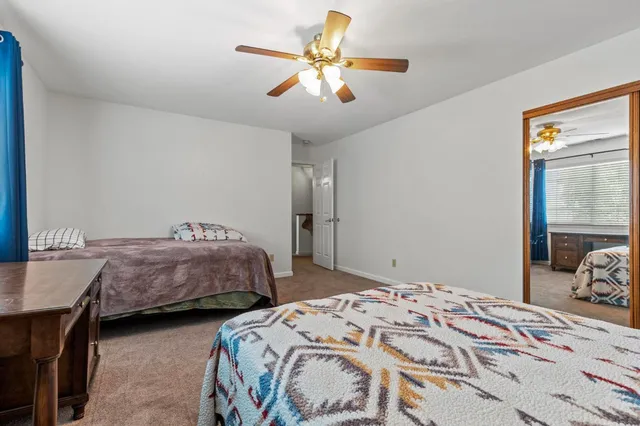 a bedroom with bed and window