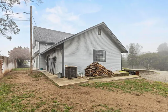 a view of a patio with table and chairs