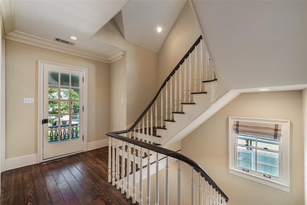 2315 Routh Street Dallas, TX 75201 - Photo 17 of 38 a view of entryway with wooden floor and stairs