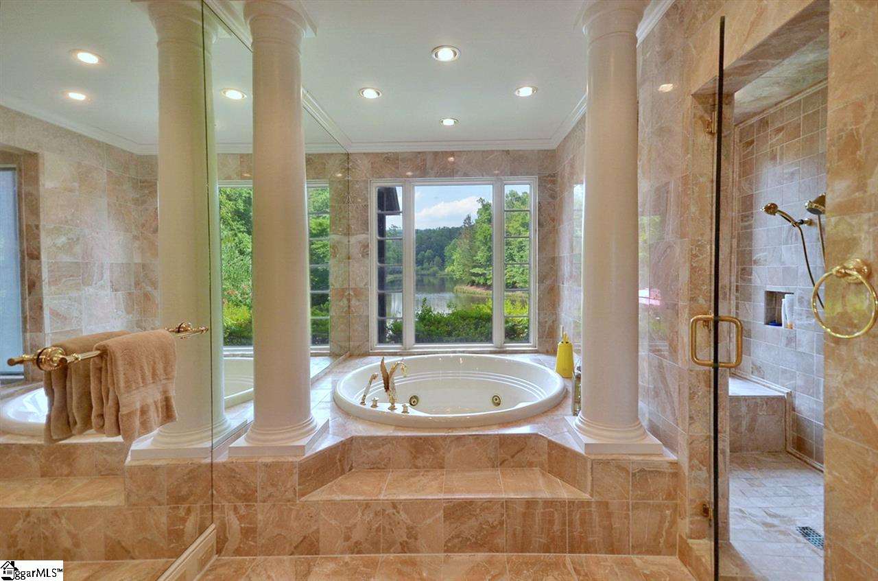 1550 Oak Grove Road Landrum, SC 29356 - Photo 14 of 28 With jetted tub, separate shower, water closet and dual vanity.