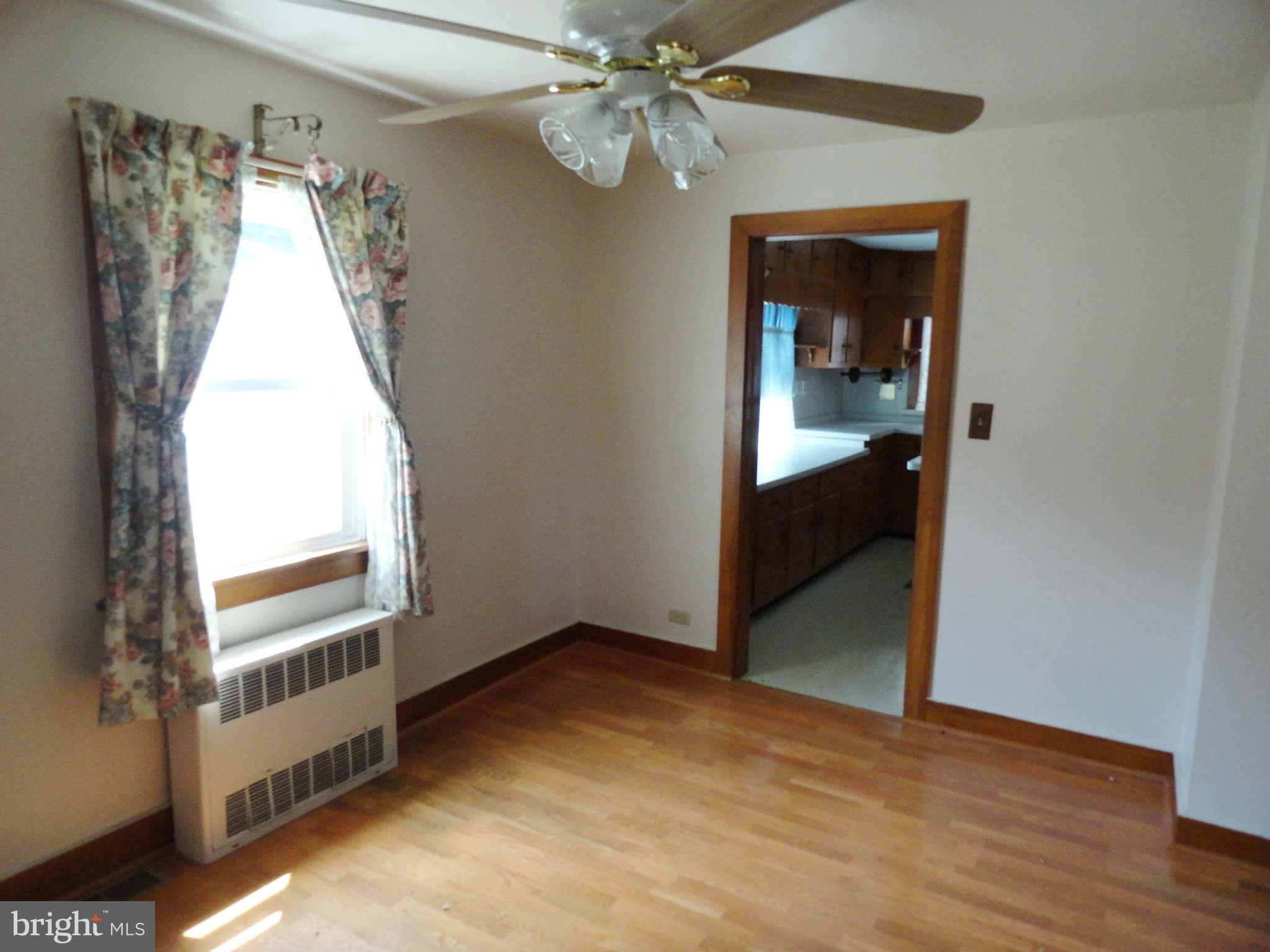 8930 Yellow Springs Road Frederick, MD 21702 - Photo 8 of 21 a view of a room with a staircase and a ceiling fan