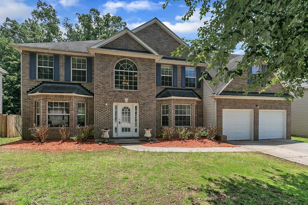 4183 Defoors Farm Drive Powder Springs, GA 30127 - Photo 1 of 1 a front view of a house with a yard