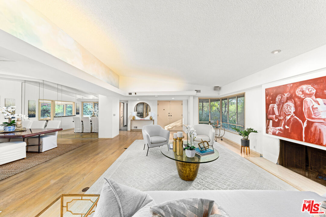 10871 Chalon Road Los Angeles, CA 90077 - Photo 11 of 41 a living room with furniture and a large window